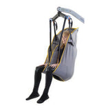 A person lifted in a Hoyer Full Back Sling