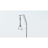 The Invacare CS600 trapeze, an upright bar with a triangle handle on a strap, mounted at the head of the bed