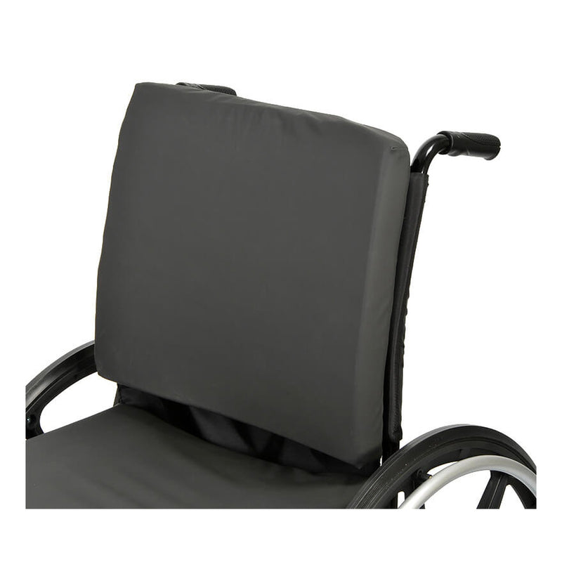 A contoured back support fitted to the back canes of a wheelchair