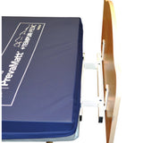 The Joerns length extender at the foot of a WeCare bed, behind the foot panel