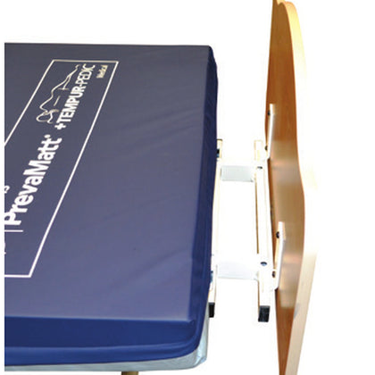 The Joerns length extender at the foot of a WeCare bed, behind the foot panel