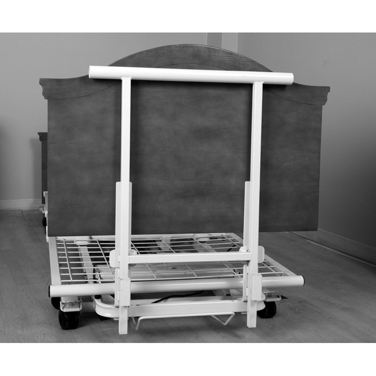 The Joerns bed transport bar standing at the end of a WeCare bed