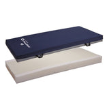 A Joerns PrevaMatt cover lifted above its foam mattress