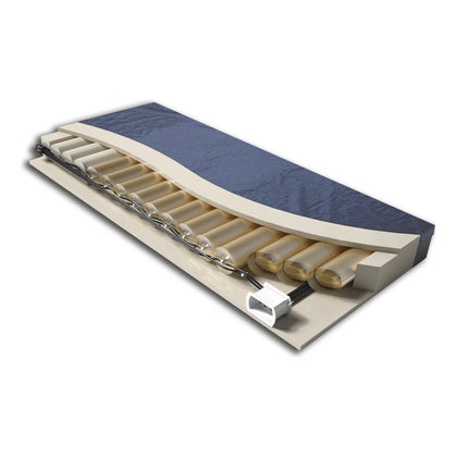 A Joerns P.R.O. Matt Plus mattress with the cover and topper cut away to show the air cells inside