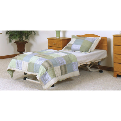 A Joerns WeCare bed made up in a bedroom, with Traditional head and foot panels