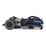 The Journey Zinger folded and resting on its own wheels so it can be rolled like a suitcase