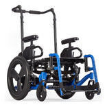 Ki Mobility Focus CR tilt in space wheelchair in blue with stroller handle back posts, front three quarter view