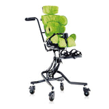 Leckey Squiggles Seat in green on the hi-low chassis with push handle, shown with the headrest, laterals and footrest add-ons; also made in blue and pink