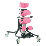 Leckey Squiggles Stander with pink positioning pads and a headrest, on the pivot base