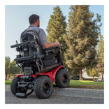 Extreme X8 climbing a curb, seen from behind
