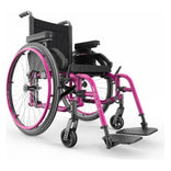 Motion Composites Helio A7 in Fuchsia with matching Air Grip handrims, front three quarter view