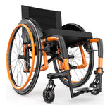 Motion Composites Veloce in Sunkissed Orange with matching Air Grip handrims, front three quarter view