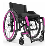 Motion Composites Veloce in High Gloss Carbon Fiber with Fuchsia highlights and matching Air Grip handrims, front three quarter view