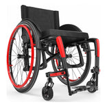 Motion Composites Veloce in High Gloss Carbon Fiber with Ferrari Red highlights and matching Air Grip handrims, front three quarter view