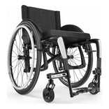 Motion Composites Veloce in High Gloss Carbon Fiber with White highlights and matching Air Grip handrims, front three quarter view