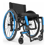 Motion Composites Veloce in High Gloss Carbon Fiber with Sky Blue highlights and matching Air Grip handrims, front three quarter view