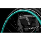 A Newton Air Grip handrim on a rear wheel