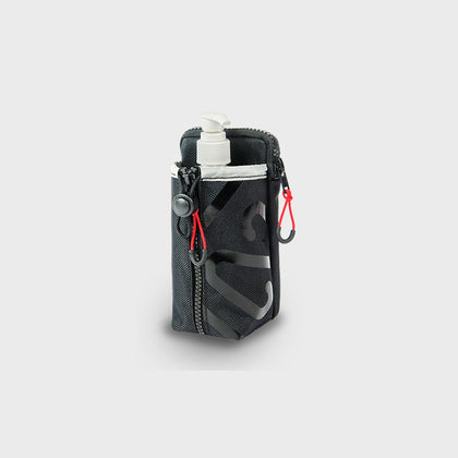 Newton multi-purpose pouch holding a sanitizer bottle