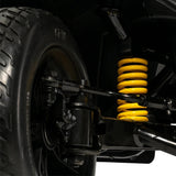 Pride Victory Platinum front suspension with yellow coil spring, close-up