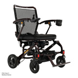 Pride Jazzy Carbon 27 power wheelchair in Black Cherry, three-quarter view from the right