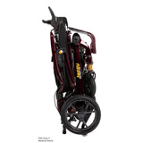 Pride Jazzy Carbon HD power wheelchair in Black Cherry, folded and standing upright