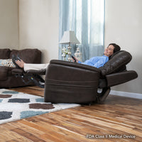 A woman lying back in the Pride VivaLift Elegance 2 lift chair in Badlands Walnut in the true infinite position, legs raised