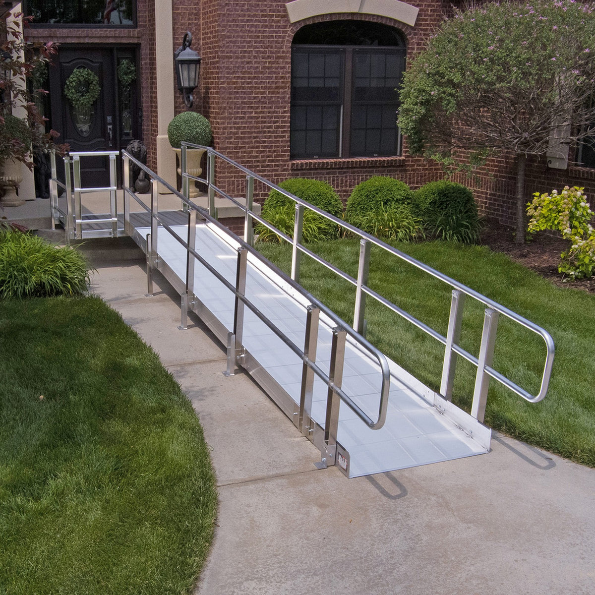 PVI Modular XP Ramp System with handrails running up to a home entrance
