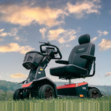Pride PX4 mobility scooter outdoors against an evening sky