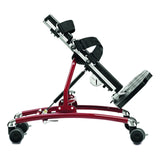 The R82 Caribou stander, size 2 in red, tilted forward, with its mast, chest pad, chest strap and footrest
