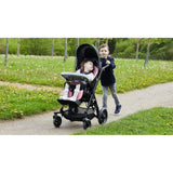 A boy walking beside a girl in a Chilla on a path through a meadow