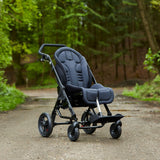 The Chilla with a grey seat and back set on a forest path