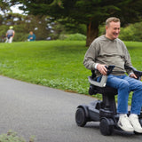 A man driving the ev¹ on a park path