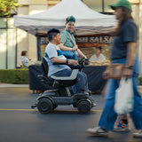 Driving the ev¹ past a street market stall