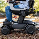 The ev¹ from the side on a bark path