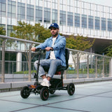 A rider on the SuperHandy Explorer on a paved walkway