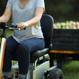 A rider on the SuperHandy Tugger towing a cart, which is sold separately