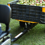 A cart hitched to the SuperHandy Tugger tow bar. The cart is not included