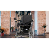 Merits Travel-Ease folding power wheelchair in a hallway