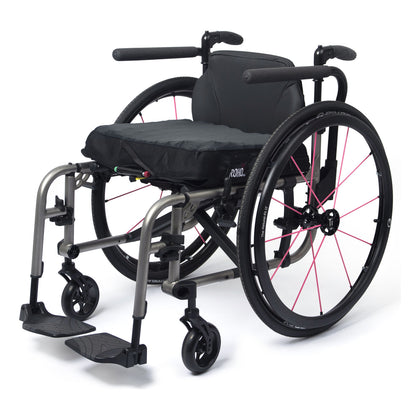 TiLite 2GX titanium folding wheelchair in satin titanium with a swing away front end and pink Spinergy spokes, front three-quarter left view