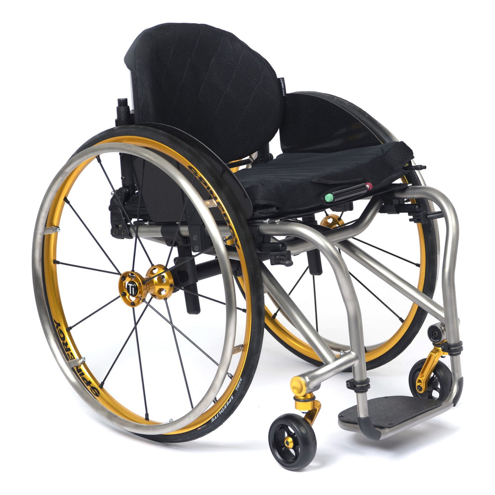 TiLite TRA titanium rigid wheelchair in satin titanium with the gold anodize package, front three-quarter view