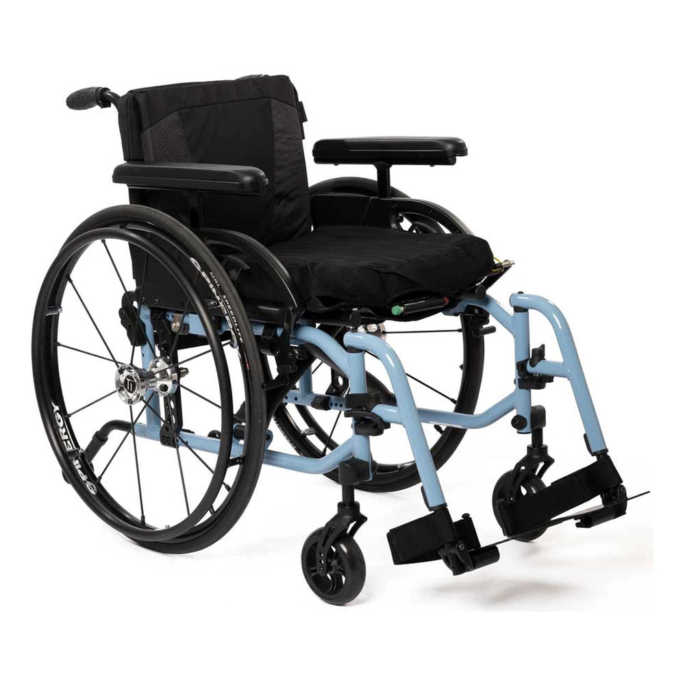 TiLite X aluminum folding wheelchair with a light blue frame, black Spinergy rear wheels and T-style armrests, front three-quarter left view