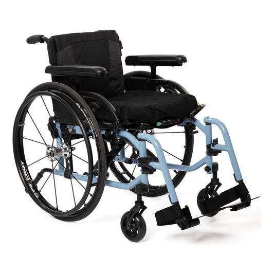 TiLite X aluminum folding wheelchair with a light blue frame, black Spinergy rear wheels and T-style armrests, front three-quarter left view