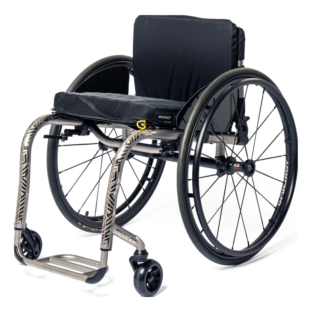 TiLite ZR titanium rigid wheelchair in satin titanium with a tattoo on the front frame tubes, front three-quarter view
