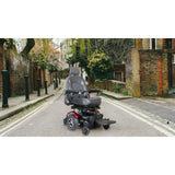 Merits Vision Super power wheelchair on a residential street