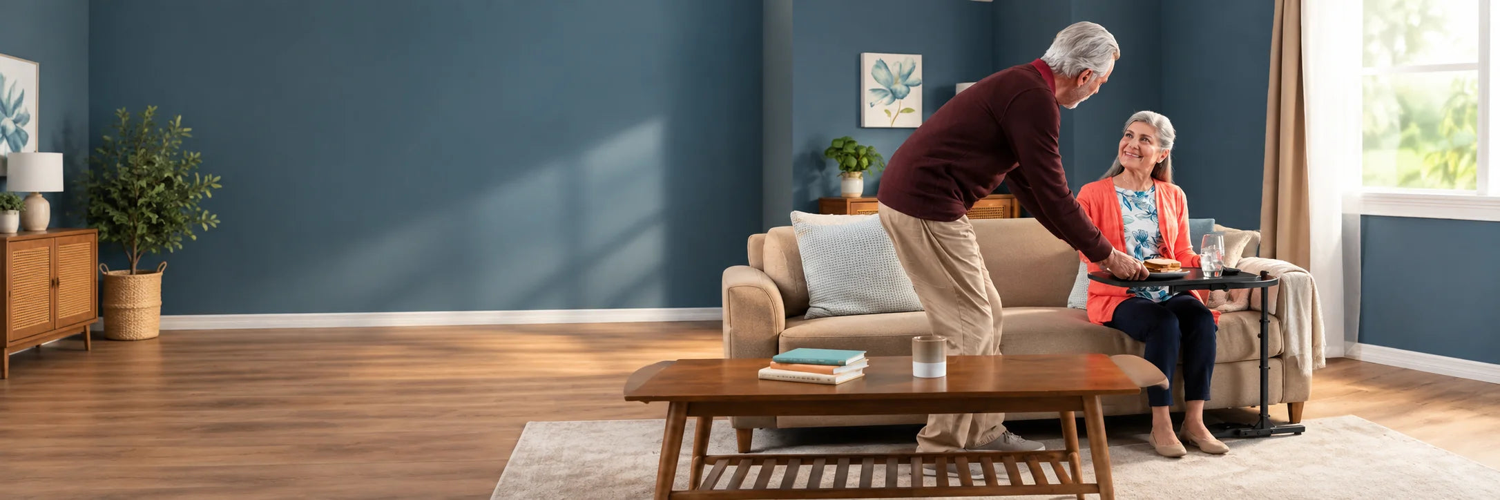 A man setting a sandwich on a swivel tray table for a smiling woman on the sofa