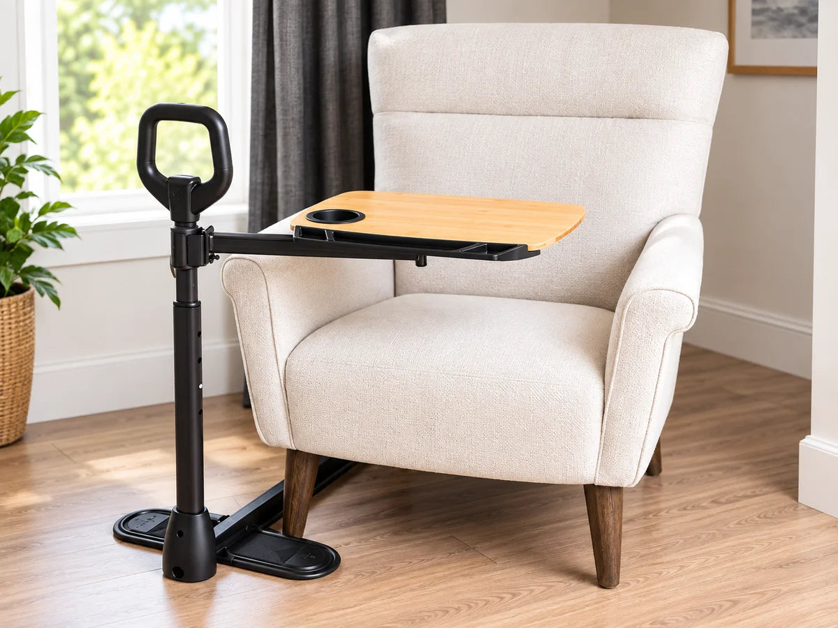 A tray table with a standing handle beside an armchair