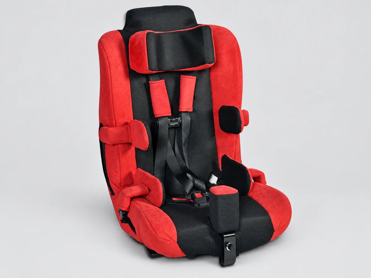 A red and black special needs car seat with head, trunk and hip supports and a five point harness