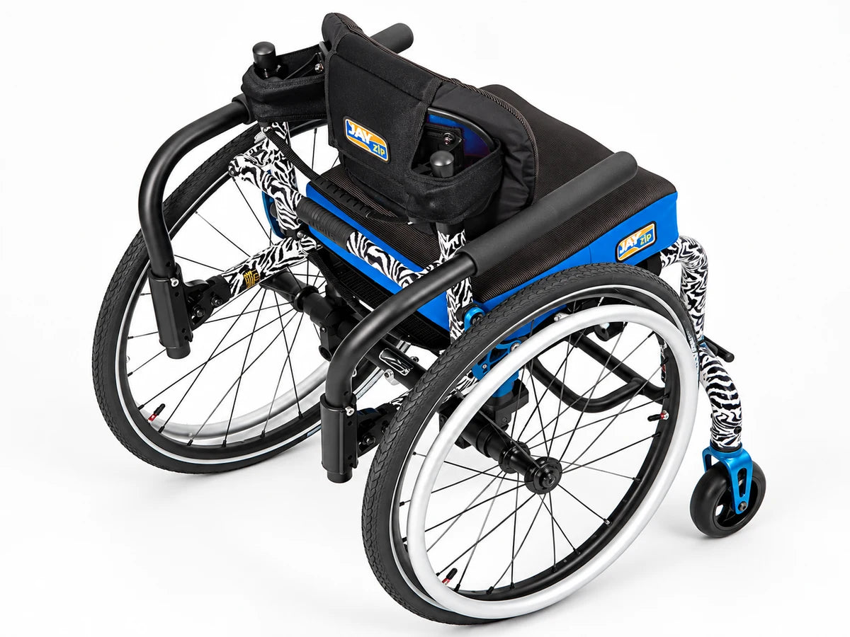 A pediatric wheelchair with a zebra print frame fitted with a contoured back and seat cushion