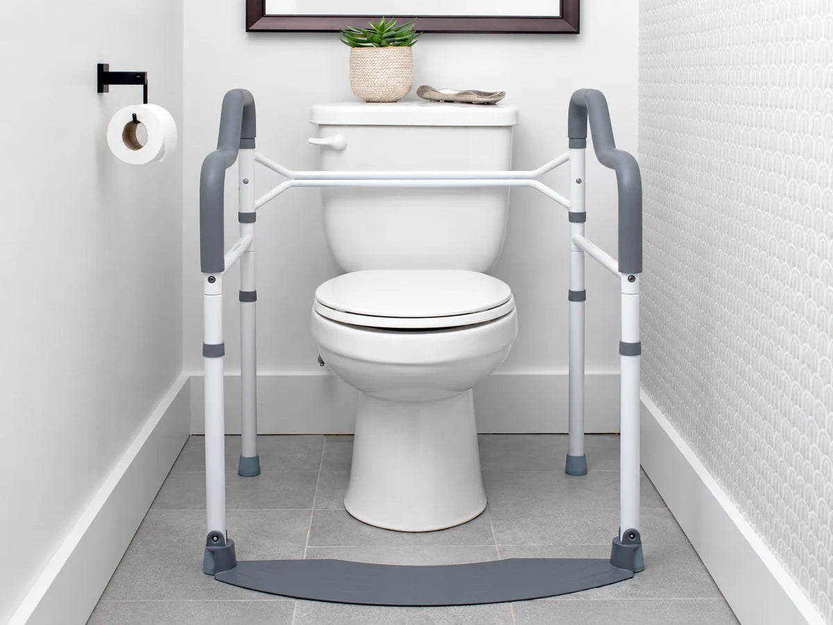 A toilet safety frame with padded armrests standing around a toilet