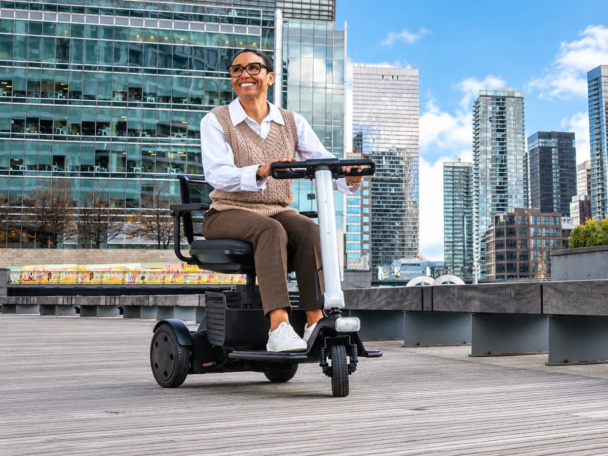 A woman riding a compact three-wheel scooter on a city boardwalk